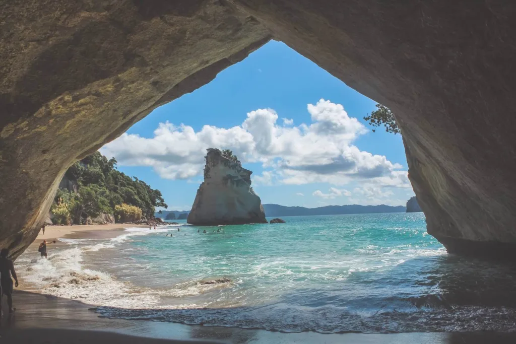 View of Cathedral cove, waves breaking on shore