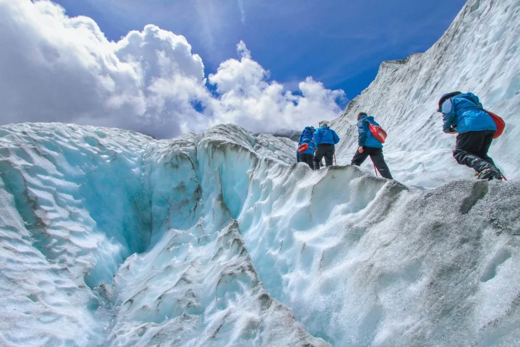 People walking up Franz Josef Glacier