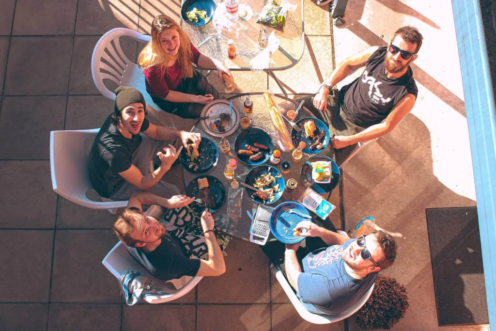 people sat around a table eating