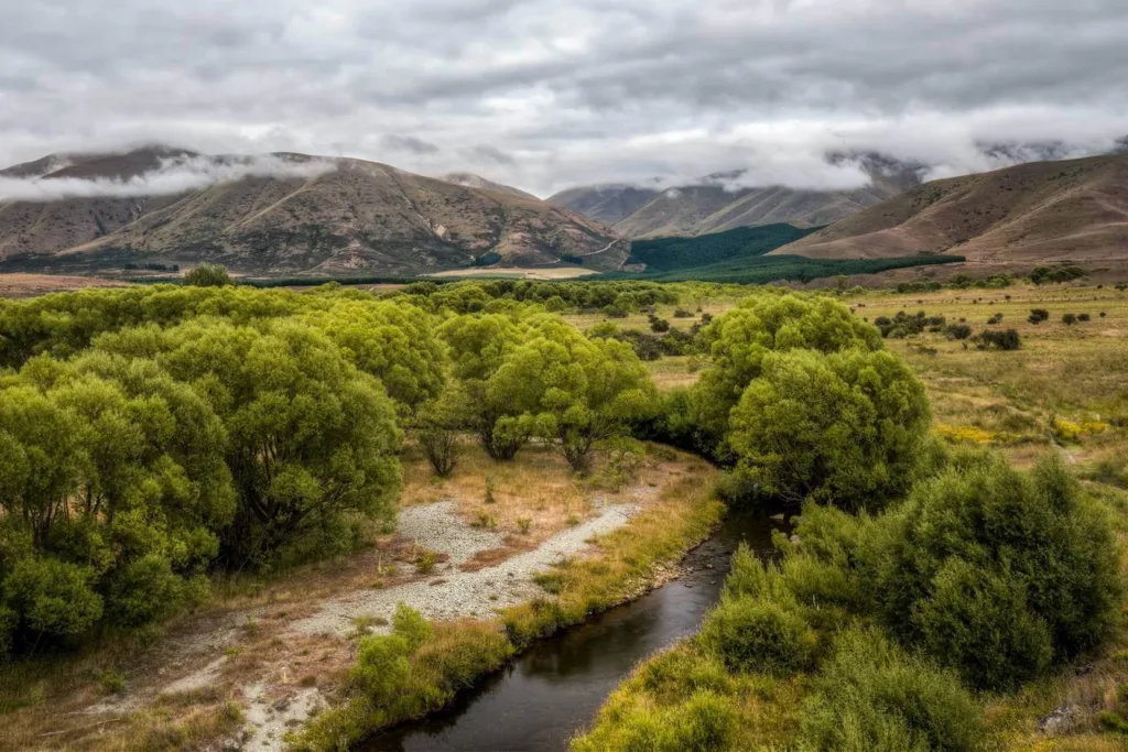 Photo of countryside with river flowing through