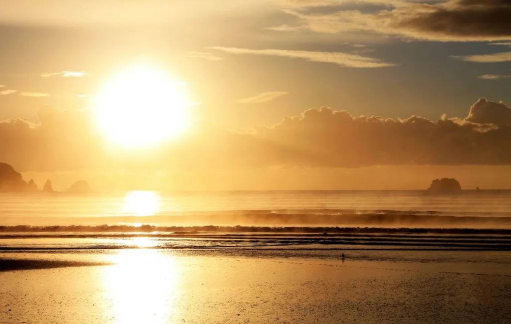 View of Whangamata beach at sunset